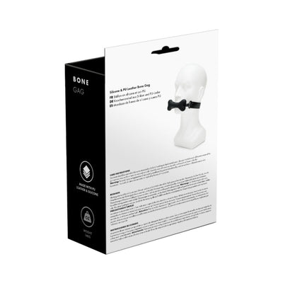 Packaging box of a black bone-shaped silicone gag with adjustable PU leather strap, shown on a white mannequin head.