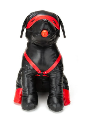 Black leather dog mannequin wearing red harness, eye mask, ball gag, and red boots on back paws.