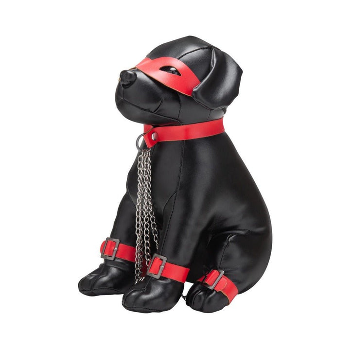 Black leather dog figurine wearing red collar, eye mask, wrist and ankle cuffs with attached silver chains.