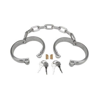 Heavy-duty stainless steel ankle cuffs with connecting chain, two locks, and keys on white background.