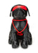Black leather dog figure wearing a red blindfold and red bondage rope harness.