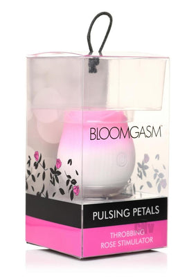 Pulsing Petals Throbbing Rose Stimulator in pink and white, packaged in clear box with floral design and black-pink label.