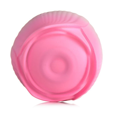 Pink rose-shaped pulsing stimulator made of smooth silicone with a textured petal design.
