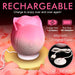 Pink rose-shaped pulsing stimulator on magnetic charging base with USB cable, surrounded by rose petals.