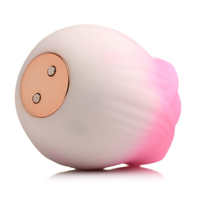 Pulsing Petals Throbbing Rose Stimulator in soft pink and white silicone with rose gold magnetic charging port.