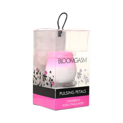 Pulsing Petals Throbbing Rose Stimulator in pink and white, packaged in clear box with floral design and black-pink label.