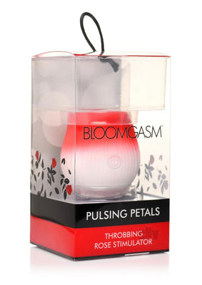 Pulsing Petals Throbbing Rose Stimulator in red and white, packaged in clear box with floral design and black-red label.