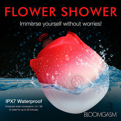 Red and white rose-shaped waterproof stimulator splashing in water, highlighting IPX7 waterproof rating for safe submersion.