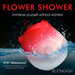 Red and white rose-shaped waterproof stimulator splashing in water, highlighting IPX7 waterproof rating for safe submersion.