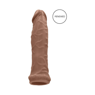 Vanilla-colored realistic textured penis extender sleeve with open base shown on white background.