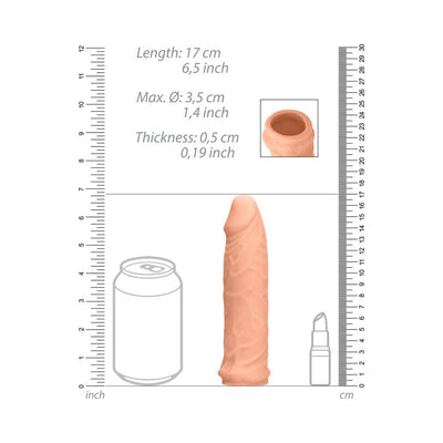 Vanilla-colored realistic penis extender with detailed texture, shown with size comparison to a soda can and lipstick.