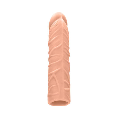 Realistic skin-toned penis extender sleeve with textured veins and open base design.