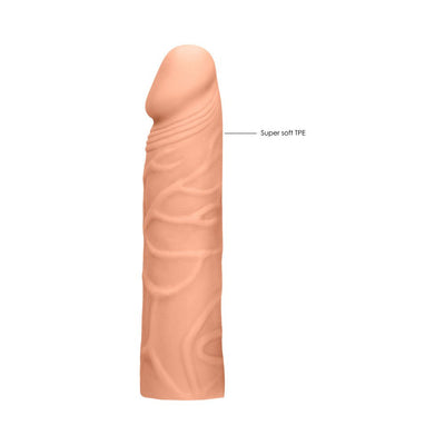 Realistic 7-inch penis extender in soft, skin-toned TPE material with detailed texture and lifelike design.