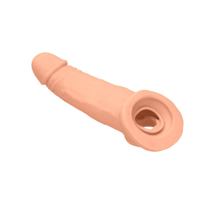 Realistic flesh-toned penis extender with textured surface and integrated rings for added support and comfort.