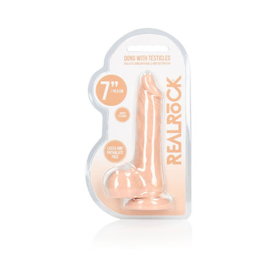 Vanilla-colored 7-inch realistic dildo with balls in clear blister packaging labeled Real Rock, phthalate-free and flexible.
