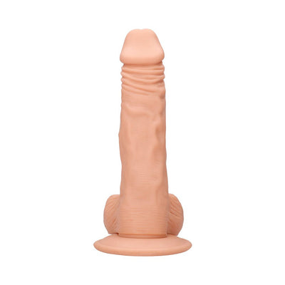 Vanilla-colored realistic dildo with detailed texture and attached balls on a suction base.