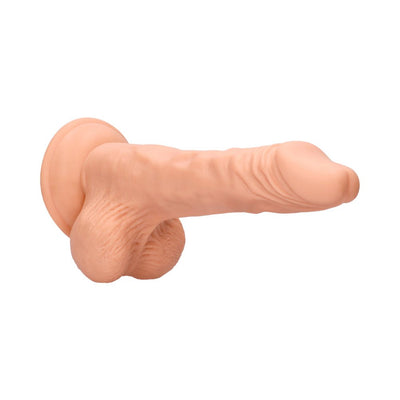 Vanilla-colored realistic dildo with textured shaft, pronounced head, hanging balls, and suction cup base.