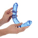 Hands holding a flexible blue crystal clear double-ended dildo with realistic texture and shape.
