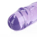 Close-up of the rounded tip of a translucent purple dual-ended dildo with smooth, glossy texture.