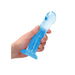 Hand holding a blue crystal clear non-realistic dildo with suction cup base against white background.