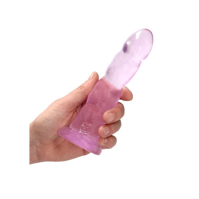 Hand holding a 7-inch pink crystal clear dildo with suction cup base on white background.