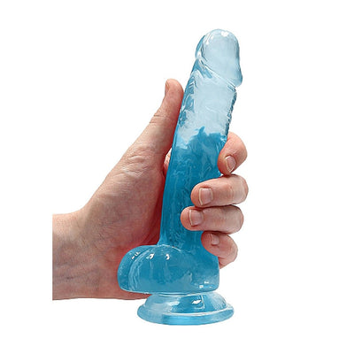 Hand holding a translucent blue realistic dildo with suction cup base and detailed texture.