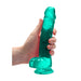 Hand holding a turquoise crystal clear realistic dildo with suction cup base and detailed texture.