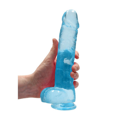 Hand holding a 9-inch translucent blue realistic dildo with suction base and detailed texture.