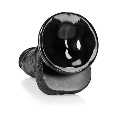 Black curved realistic dildo with suction cup base and textured shaft angled on white background.