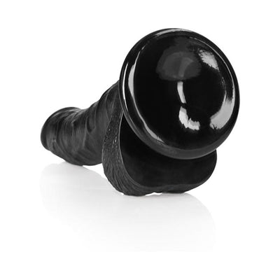 Black curved realistic dildo with textured shaft, balls, and suction cup base on white background.
