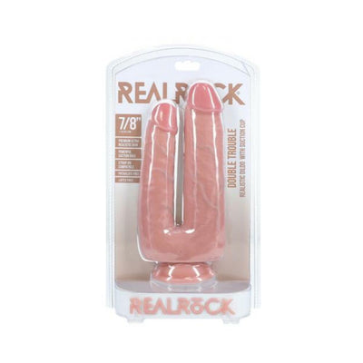 Realrock Double Trouble dual-ended dildo in natural skin tone with suction cup base in clear retail packaging.