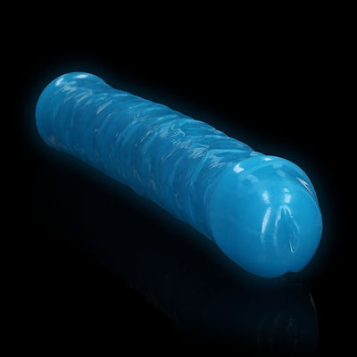 Blue glow-in-the-dark dual-ended dildo with textured surface and realistic shape on black background.