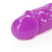 Close-up of the purple glow-in-the-dark double-ended dildo tip with a smooth, glossy finish.