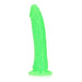 Slim neon green glow-in-the-dark dildo with suction cup base, textured for realistic feel.