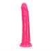 Bright pink slim 7-inch dildo with suction base, designed for glow-in-the-dark use and versatile stimulation.