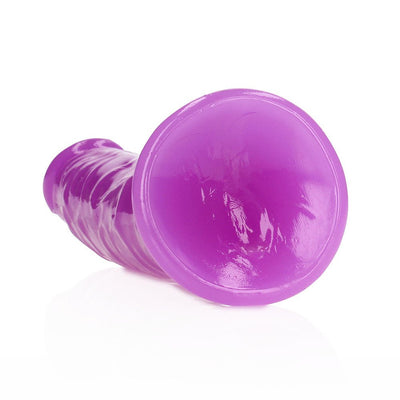 Purple glow-in-the-dark slim dildo with suction cup base, textured for added stimulation.