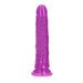 Slim 7-inch purple glow-in-the-dark dildo with textured shaft and suction cup base for hands-free use.