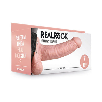 Realrock Hollow Strap-On with balls in vanilla color displayed in packaging showing realistic 7-inch size and adjustable black strap.