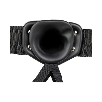 Close-up of the black hollow strap-on harness with adjustable elastic straps and a smooth silicone insert ring.