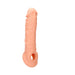 Realrock 8-inch flesh-tone penis sleeve with strap for secure fit, made from soft, body-safe TPE material.