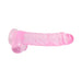 Pink translucent realistic dildo with textured shaft and suction cup base isolated on white background.
