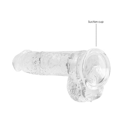Clear realistic dildo with suction cup base and textured surface for secure attachment and lifelike feel.
