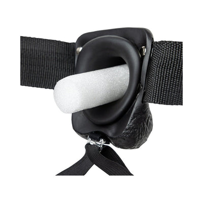 Close-up of black adjustable strap-on harness with foam insert for shape and support.