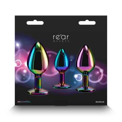 Three chrome-plated, rainbow-colored aluminum trainer plugs in small, medium, and large sizes displayed on black packaging.