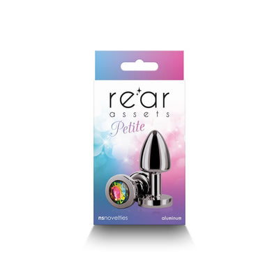 Petite metal anal plug in gunmetal with rainbow jewel base displayed on colorful Rear Assets packaging.