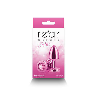 Pink petite metal anal plug with jewel base displayed on pink and white Rear Assets packaging.