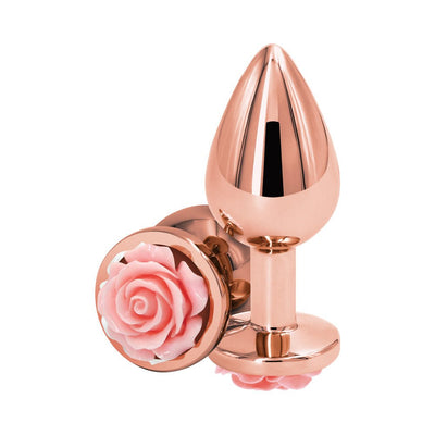 Medium-sized rose gold metal anal plug with decorative pink rose detail on the base, polished finish.