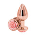 Medium-sized rose gold metal anal plug with decorative pink rose detail on the base, polished finish.