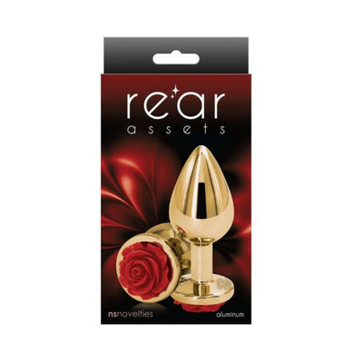 Gold-toned medium-sized aluminum anal plug with a red rose detail on the base, displayed on black and red packaging.