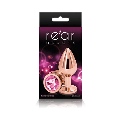 Rose gold medium-sized aluminum butt plug with a pink gem base displayed on black and purple packaging.